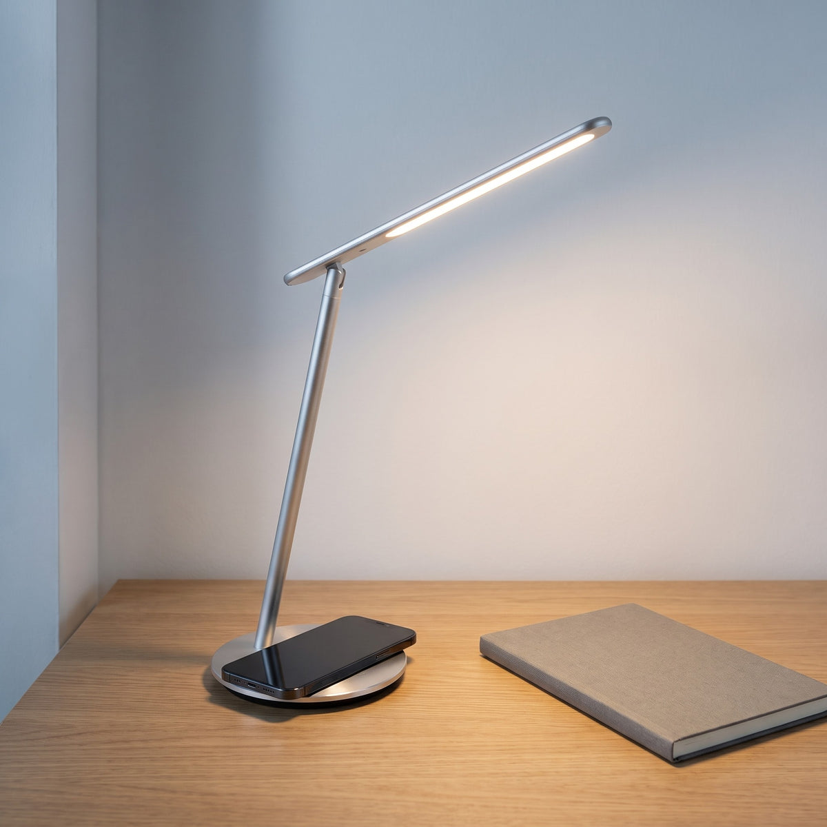 LED Desk Lamp with Wireless Charger in use
